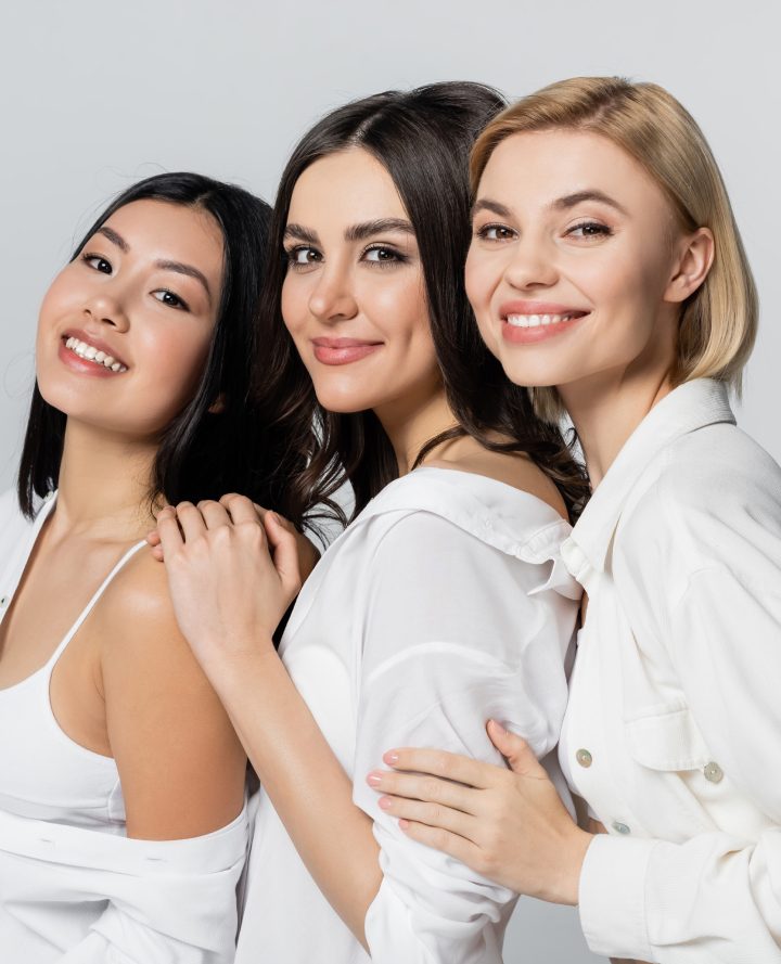 Three women smiling